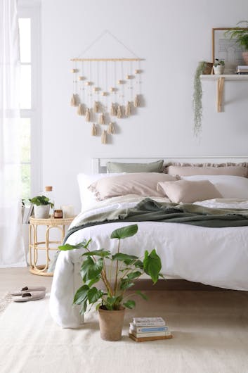 a calm neutral bedroom illustrating the concept of hygge