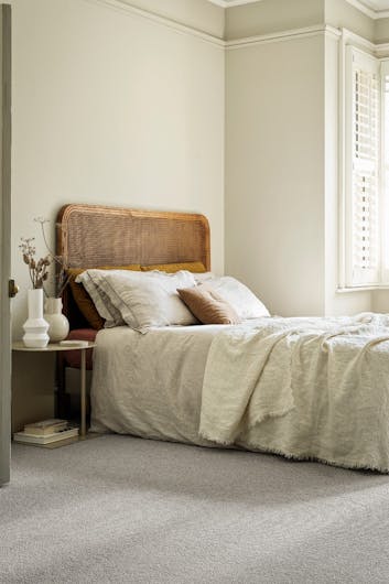 a calm and chilled bedroom in neutral tones
