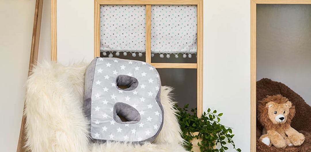 children's bedroom makeover with furry chair and cuddly lion toy